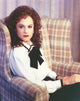 Holly Hunter seated on couch in white dress photo print
