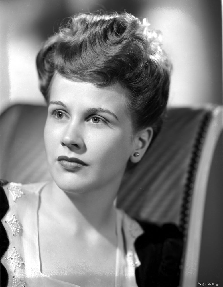Kim Hunter portrait photo print seated on a couch