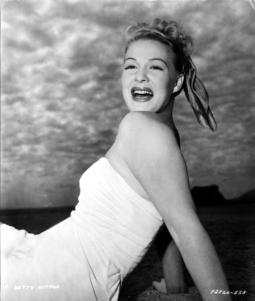 Betty Hutton reclining and laughing photo print