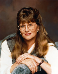 Judith Ivey close-up portrait photo print featuring eyeglasses and a tunic.
