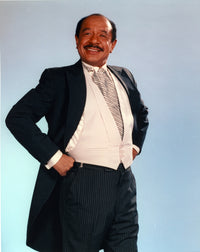 Jeffersons posed in black sport coat and white vest suit photo print