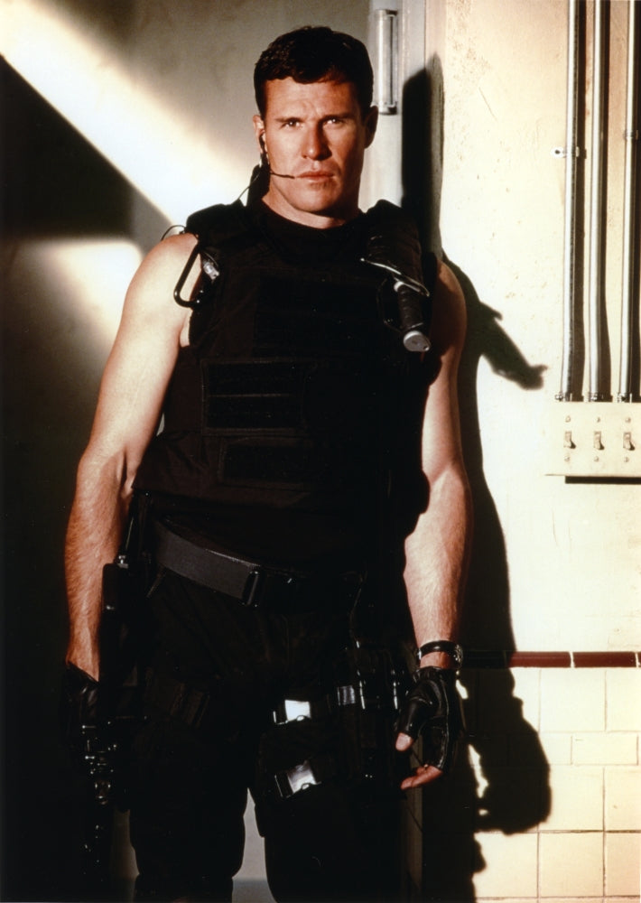 Brad Johnson posed in a black suit photo print