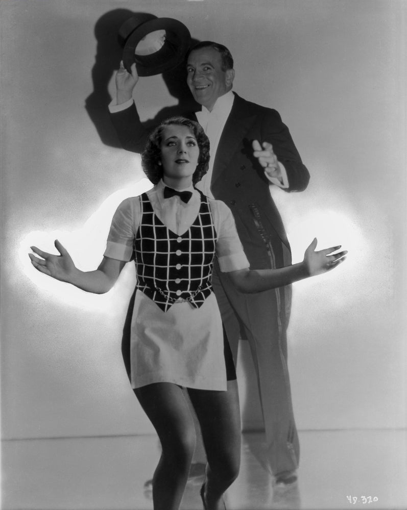 Vintage photo print of Al Jolson posed with a woman in a suit