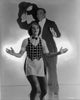 Vintage photo print of Al Jolson posed with a woman in a suit