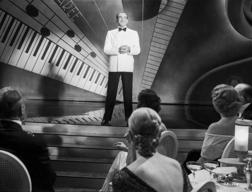 Al Jolson performing on stage in a white suit photo print