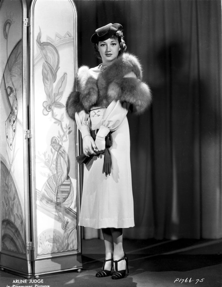 Arlene Judge standing in a fluffy shawl with heels photo print.