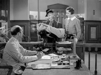 A scene from Bachelor Mother Photo Print showcasing classic cinema.