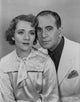 Al Jolson photo print taking a picture with a woman in matching clothes.