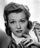 Nancy Kelly thoughtful pose photo print with finger on chin