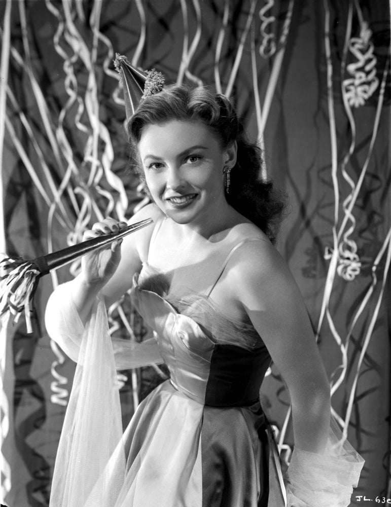 Joan Leslie smiling and posed in a stunning dress photo print.