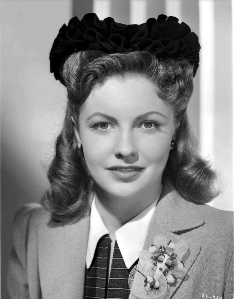 Joan Leslie posed photo print showcasing classic Hollywood glamour.