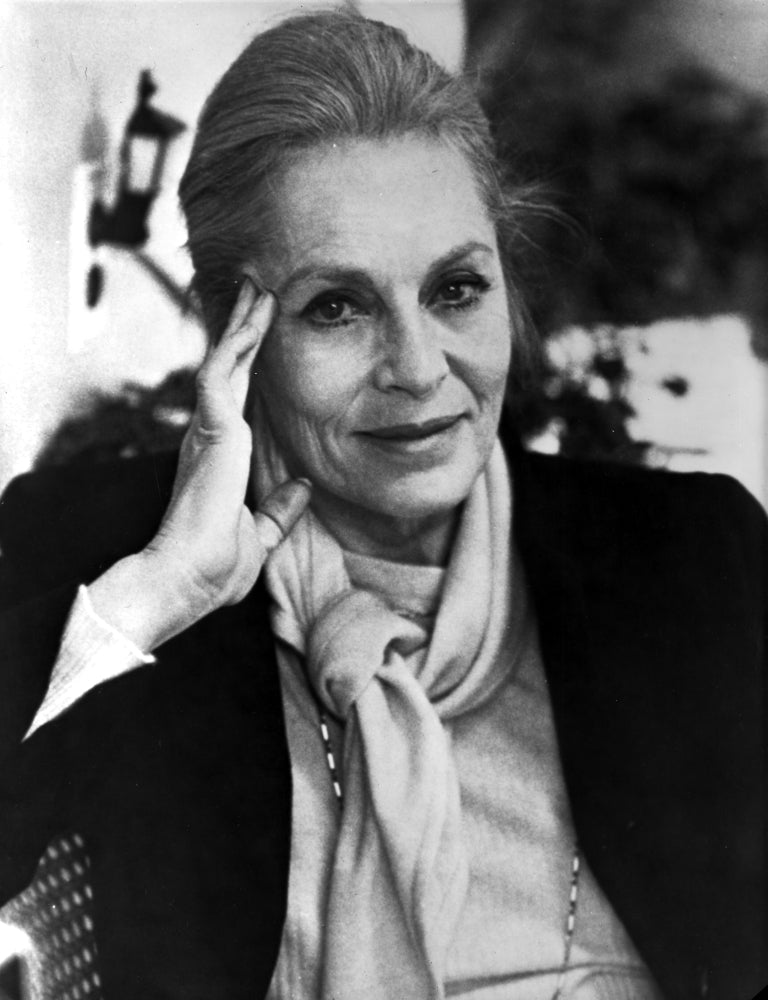 Viveca Lindfors photo print leaning head on hand and smiling.