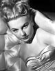 Joan Lorring elegantly posed in a silk top photo print