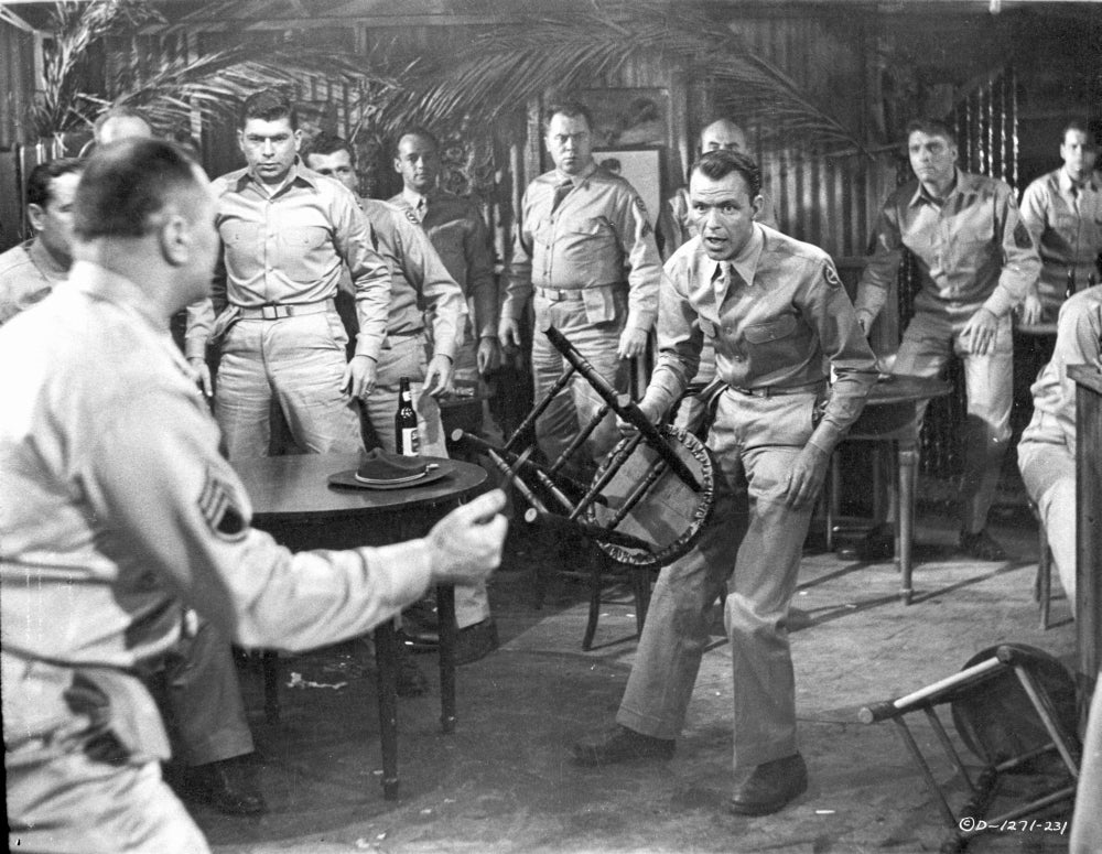 From Here To Eternity photo print - man carrying chair surrounded by policemen.