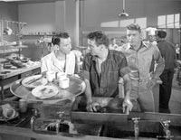 Photo print from From Here To Eternity showing three men talking in a kitchen.