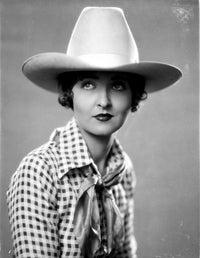 Gladys McConnell posed photo print on checkered top.