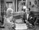 Born Yesterday black and white photo print featuring a man and woman talking.
