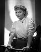 Dorothy McGuire Standing and Holding on a Wood Photo Print