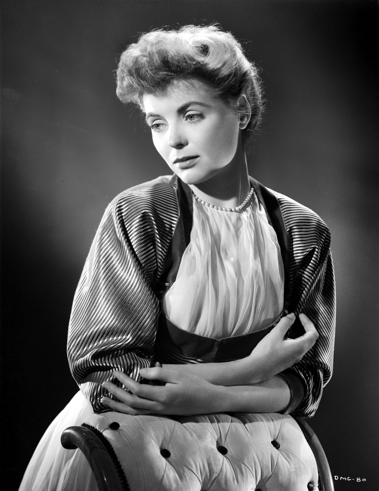 Dorothy McGuire posed photo print leaning against a backdrop