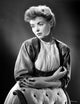 Dorothy McGuire posed photo print leaning against a backdrop