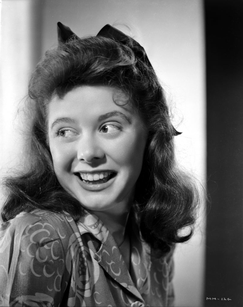 Marcy McGuire laughing in a printed top photo print