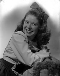 Marcy McGuire sitting and laughing long sleeve photo print.