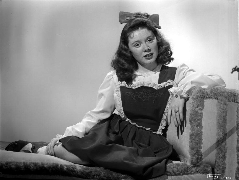 Marcy McGuire seated photo print showcasing her elegance and charm.