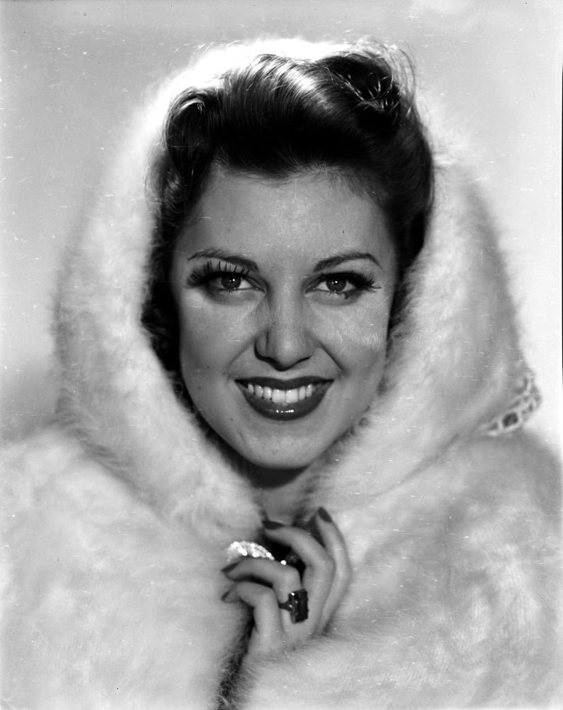 Fay McKenzie smiling in a furry hood coat photo print
