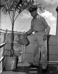 Mister Roberts photo print of a man holding a water can.