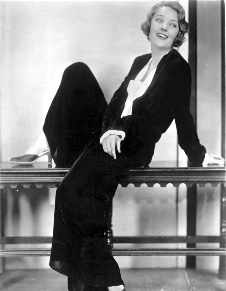 Dorothy MacKail sitting on a table photo print.