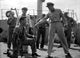 Mister Roberts photo print featuring a man kneeling around sailors.