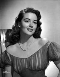 Dorothy Malone smiling in a lace dress photo print