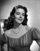 Dorothy Malone smiling in a lace dress photo print