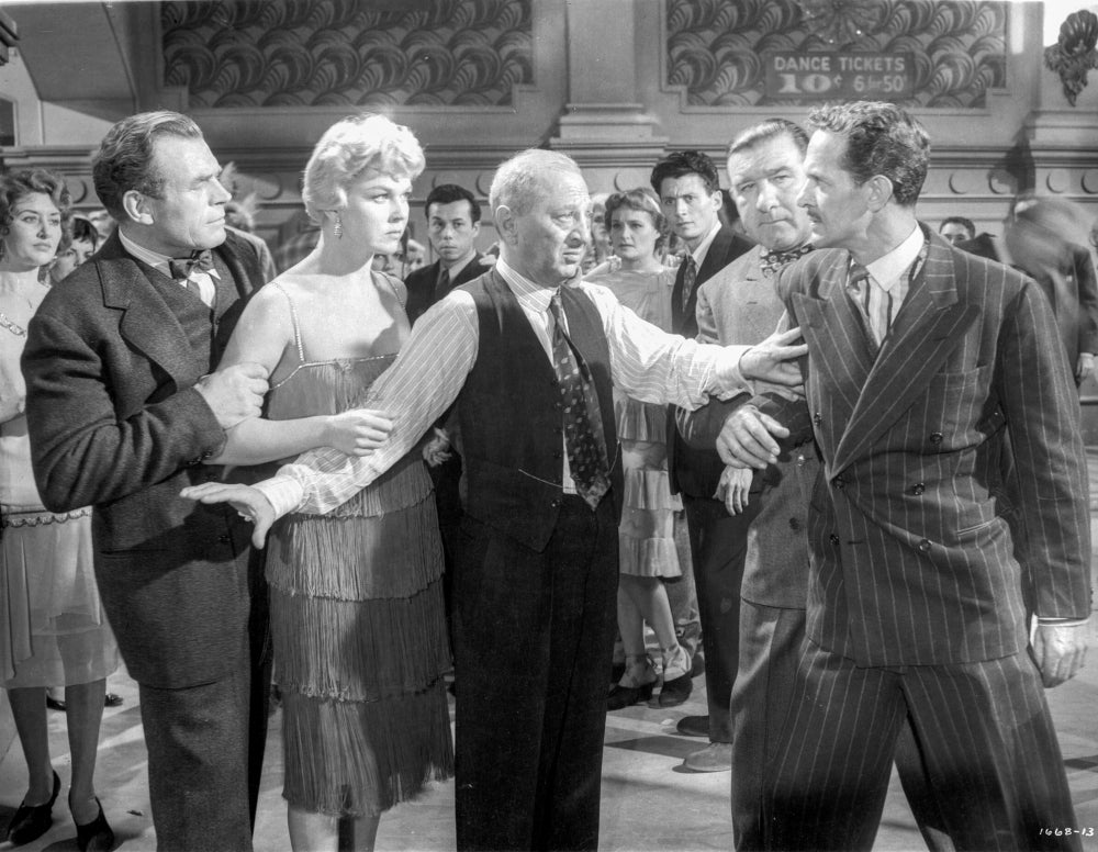 Love Me Or Leave Me movie scene photo print featuring a man in a blazer stopping a fight.