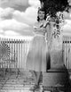 Dorothy Malone posed photo print in a dress leaning pose.