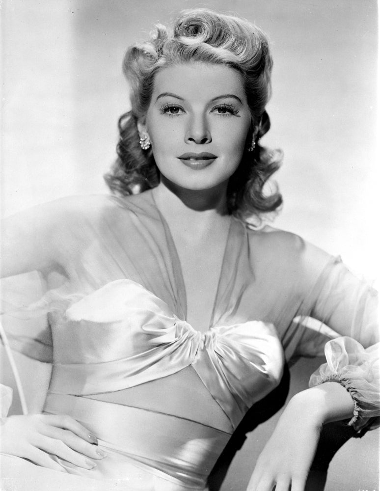 Irene Manning wearing a silk dress in a vintage photo print