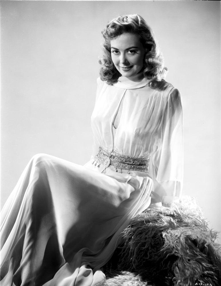 Adele Mara smiling on a lace top photo print