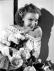 Margo on a Lace Smiling with Flowers Photo Print showcasing vibrant flowers and joyful expression.