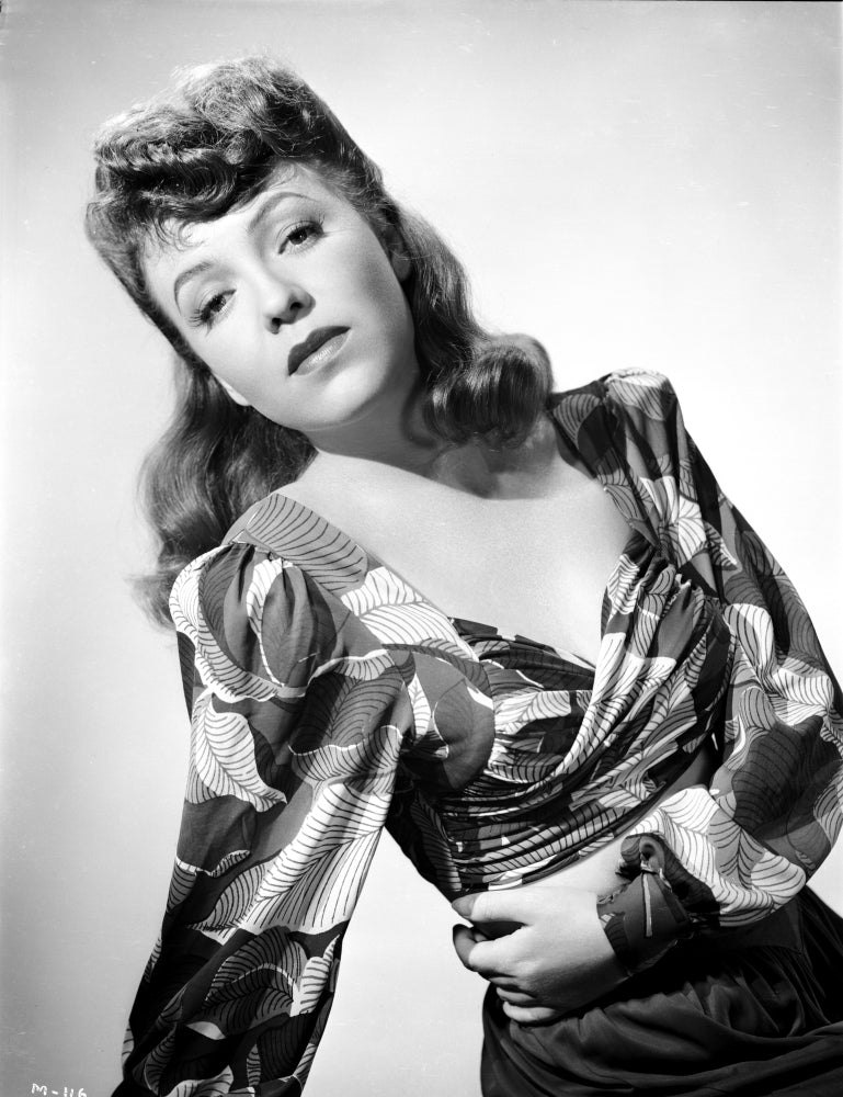 Margo on Printed and Ruffled Top Photo Print showcasing a stylish figure in a chic outfit.