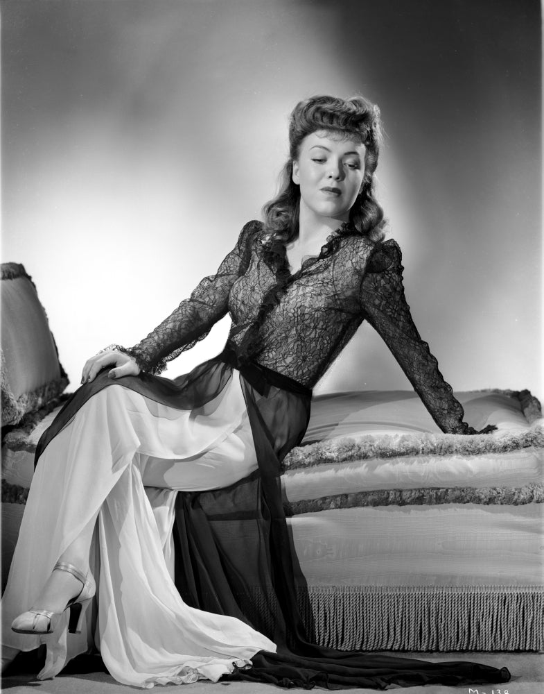Margo Sitting and Looking Down Photo Print showcasing serene pose and elegant composition.