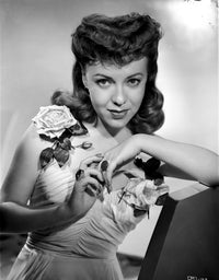 Margo smiling in a floral dress photo print