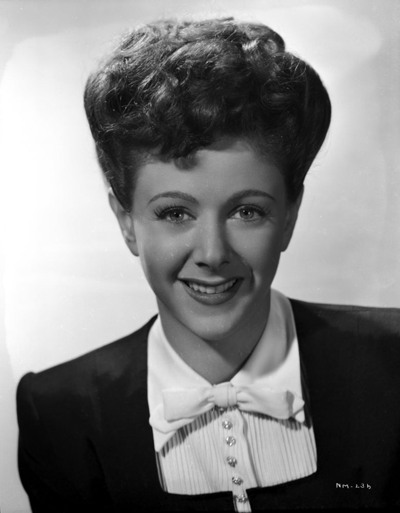 Nancy Marlow smiling portrait photo print in blazer, available in multiple sizes.