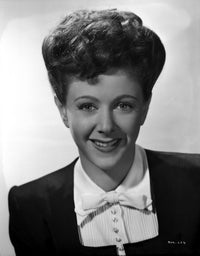 Nancy Marlow smiling portrait photo print in blazer, available in multiple sizes.