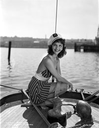 Mary Martin sitting portrait photo print in a printed dress.