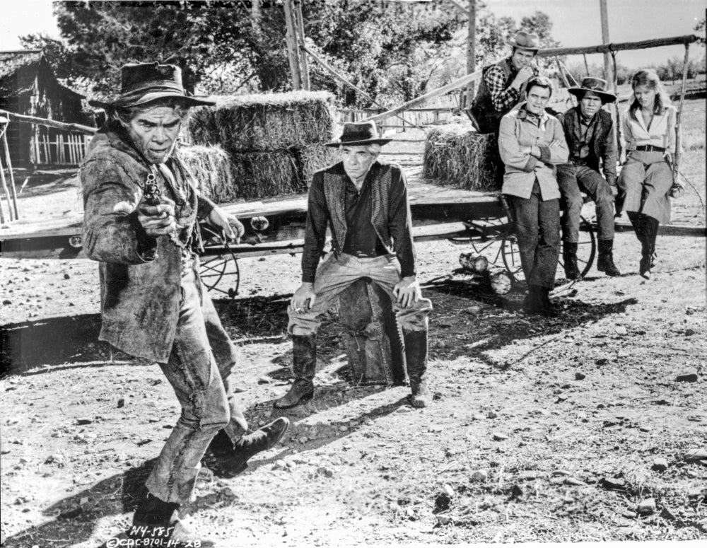 Cat Ballou black and white photo print featuring four people watching