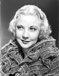 Una Merkel smiling portrait photo print in ruffled top.