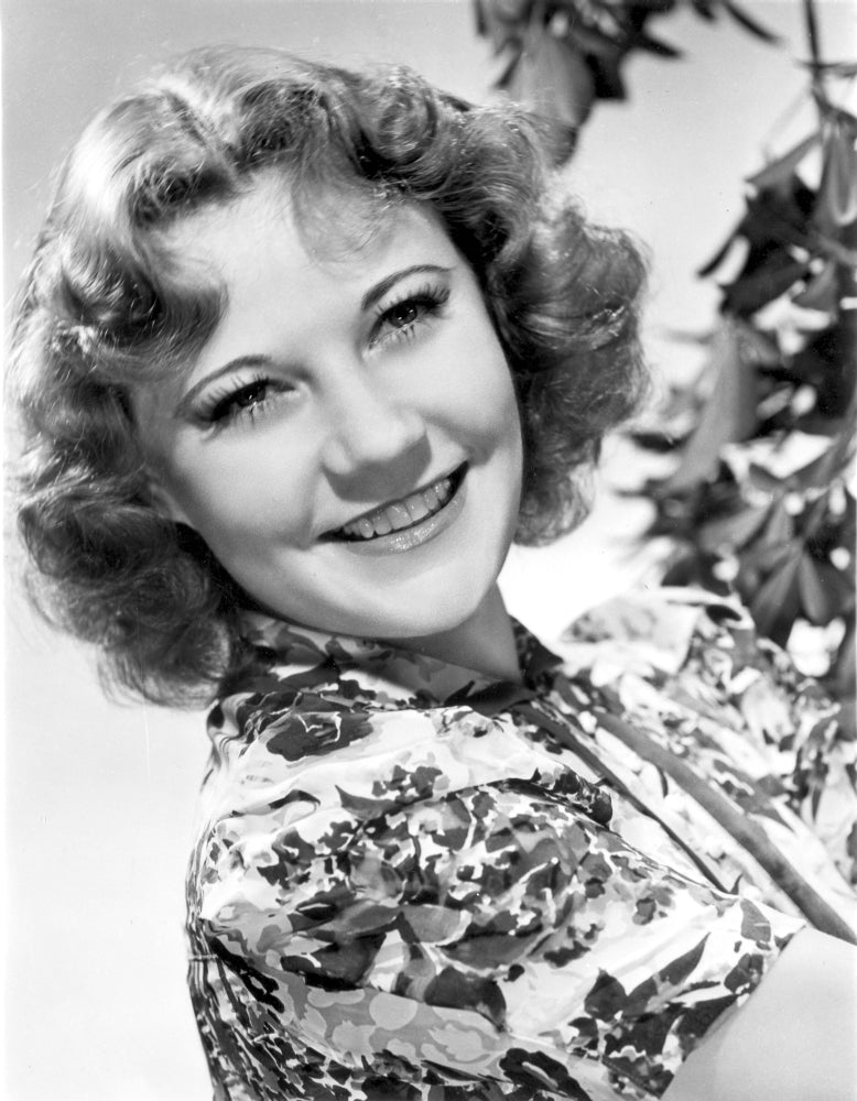 Portrait photo print of Una Merkel smiling.