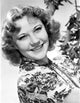 Portrait photo print of Una Merkel smiling.