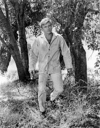 Chase Man Standing in The Grass Photo Print showcasing serenity and nature.
