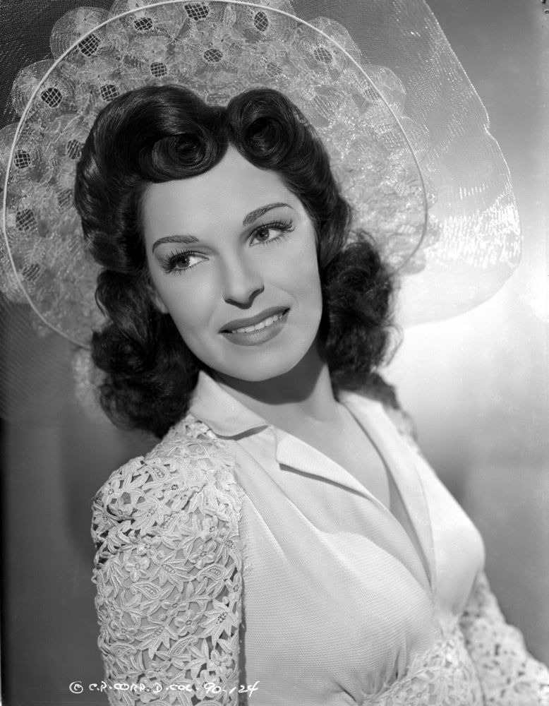 Joan Merrill portrait photo print leaning to the right wearing a white blouse